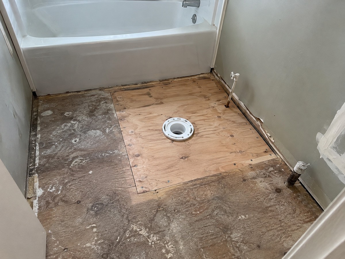 Soft subfloor around the toilet and tub cut out and replaced