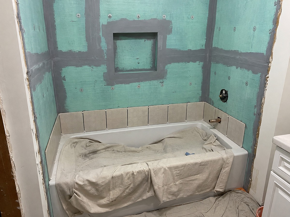 Backer board, waterproofing and tile on walls and floor