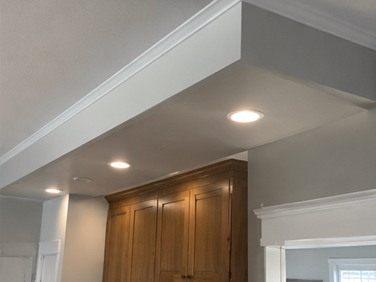 Soffits, bulkheads and ceiling work above the cabinets