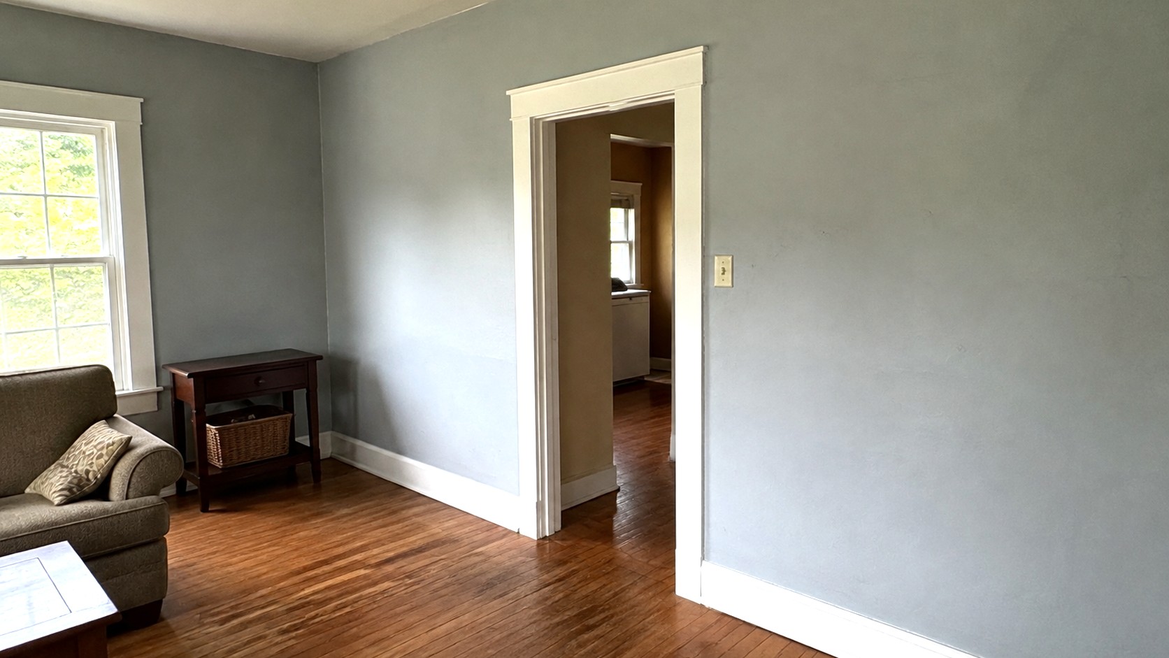 Crown molding and baseboard trim installed in a finished room
